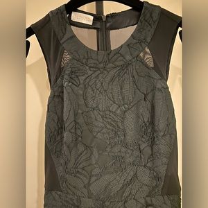 Stunning fitted upper body dress with full skirt detail. Incredibly flattering!